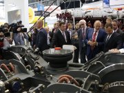Глава правительства России Дмитрий Медведев и  губернатор Свердловской области Евгений Куйвашев осматривают экспозицию выставки